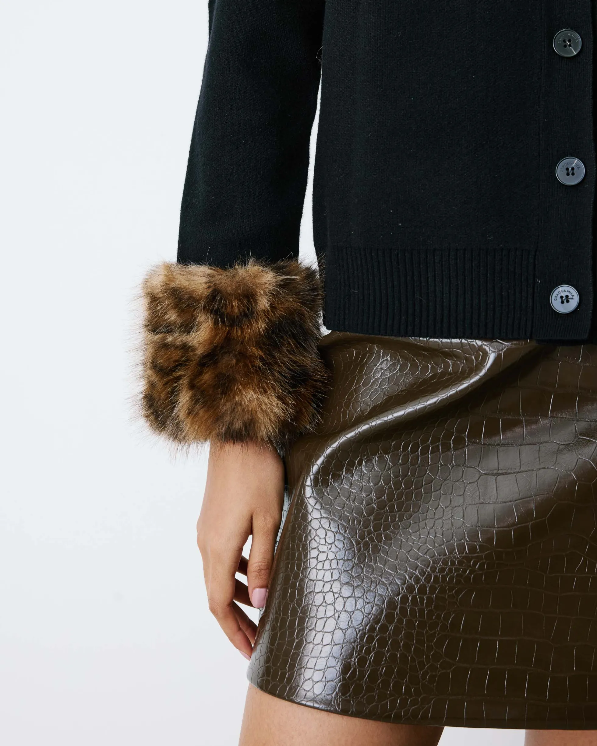 Gilet en maille poignets fausse fourrure noir Bambino