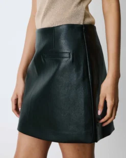 Mini-jupe en similicuir lisse noir Betty