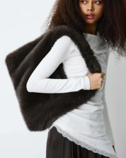 Top asymétrique manches longues bas en dentelle ivoire Bina